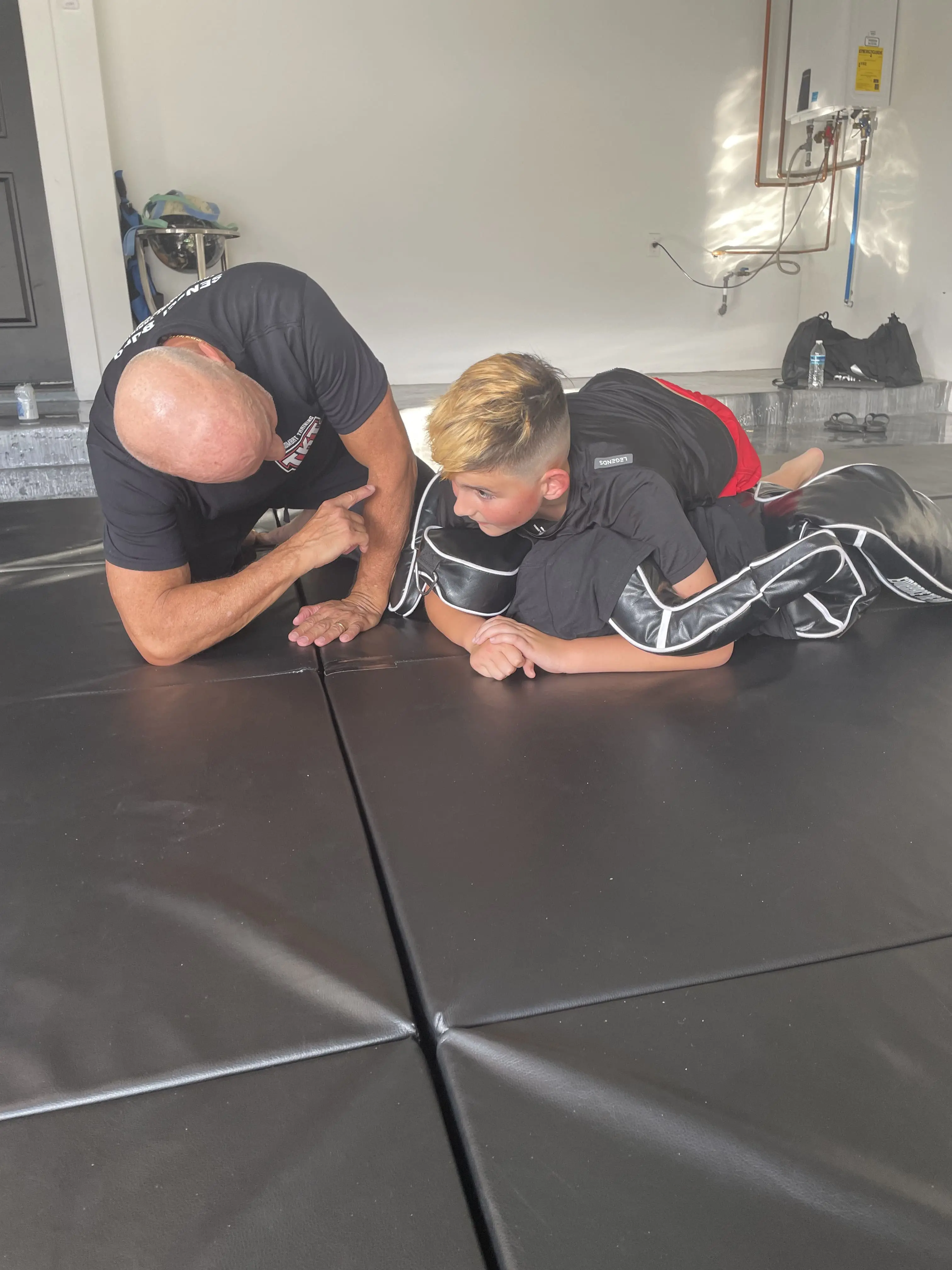 Instructor setting up mats in a Boynton Beach home